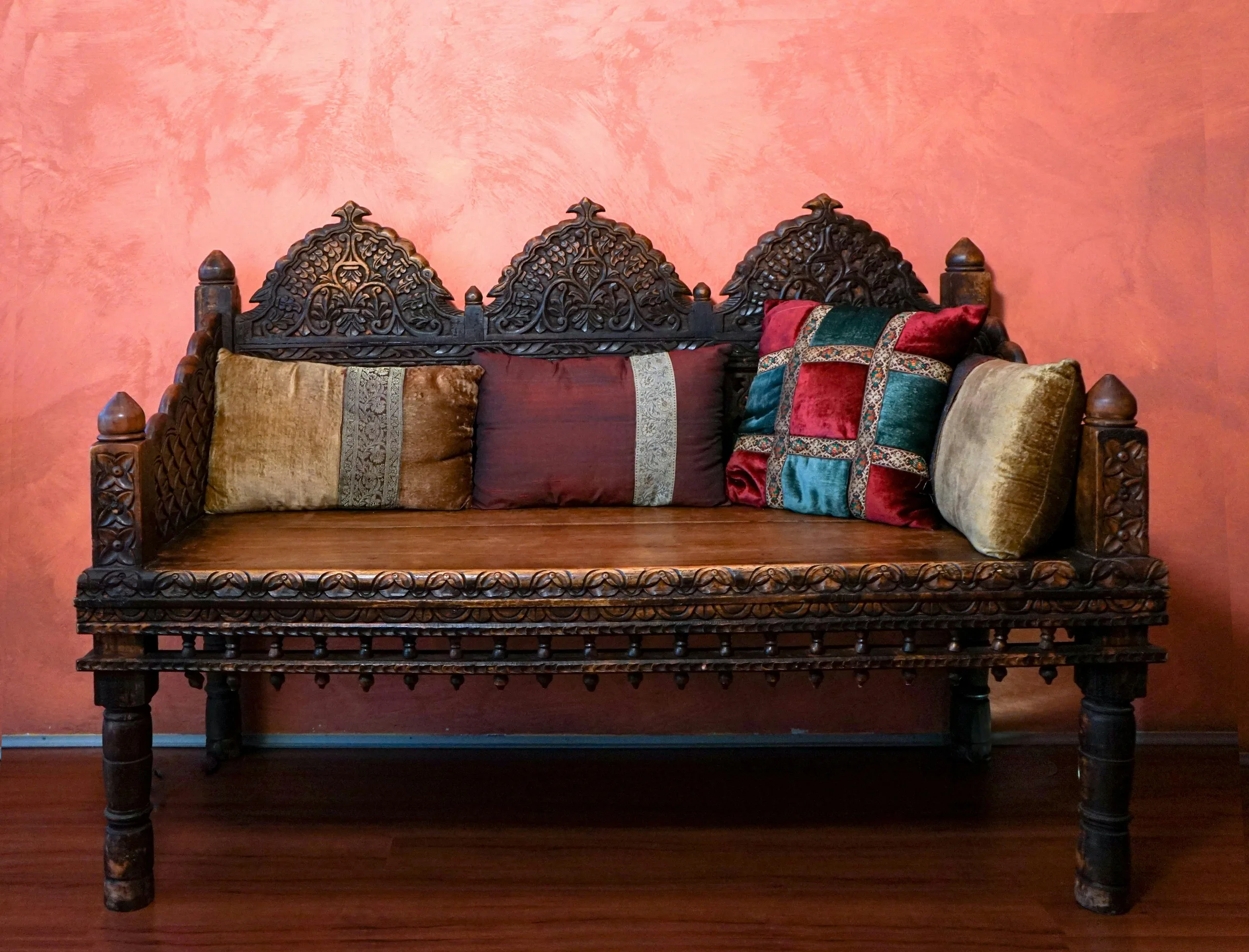 Reading Nook Lounge — Reference: carved wooden daybed with arched crests and cushions